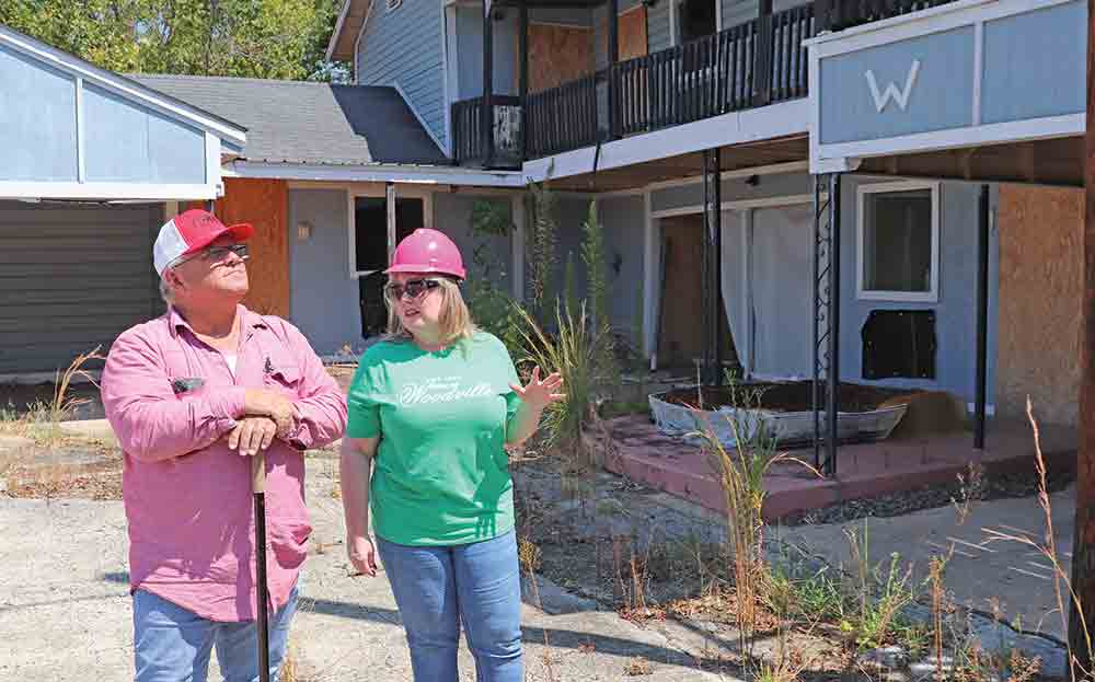 Contractor Steve Baker, with SRB Enterprises, LLC and Woodville Mayor Amy Bythewood examine the site of the Willis Motel, which will soon be demolished. The motel was condemned by the city. CHRIS EDWARDS | TCB