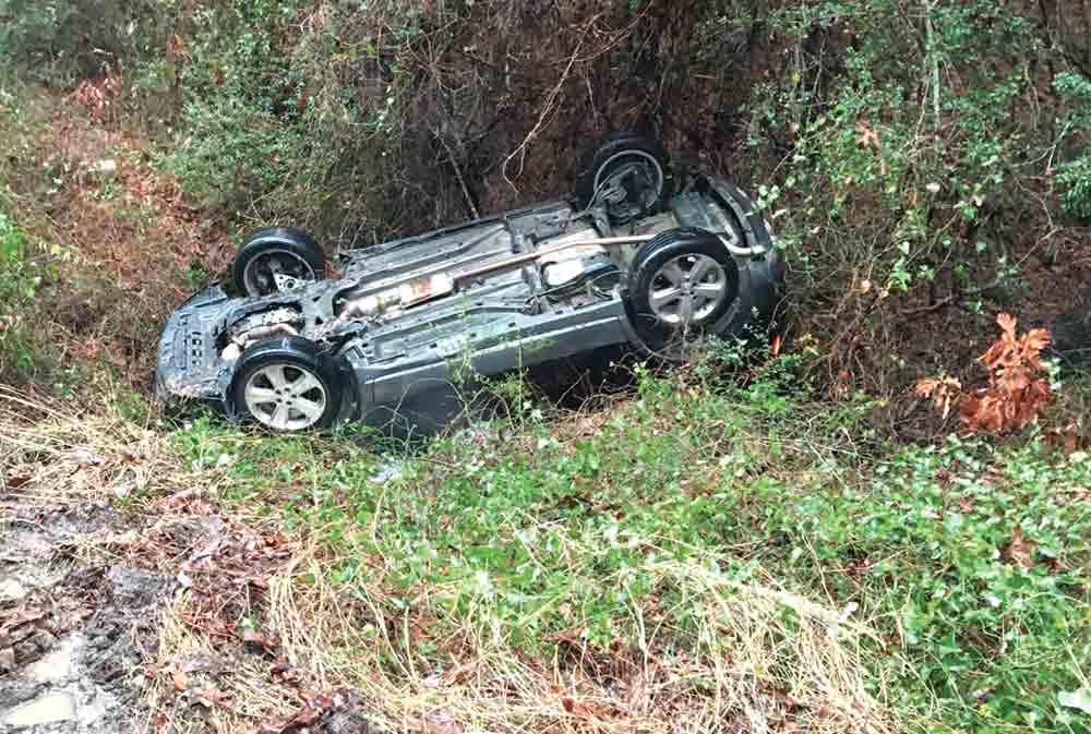 (Above) Trinity firefighters assisted an adult and two children following a rollover crash on Monday afternoon. A Trinity resident was injured after the Toyota Tundra he was driving collided with a guardrail on Saturday.