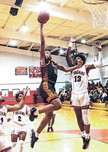 Terius Maxie (No. 22) grabs air on the way for 2 points. Photos by Charles Ballard