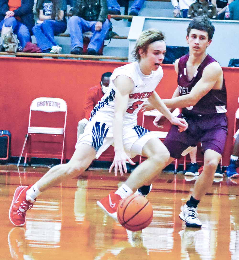 Groveton Indian Jackson Cathey (No. 3) looks for the lane during the Jan. 18 game against Lovelady. The Indians lost 68-22. Photos by Martha Mericle