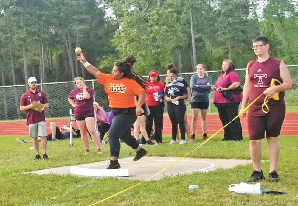 Kailyn Fisher of Trinity tosses the shot for a first-place posting in the event. Fisher now heads to the area meet. Courtesy photo