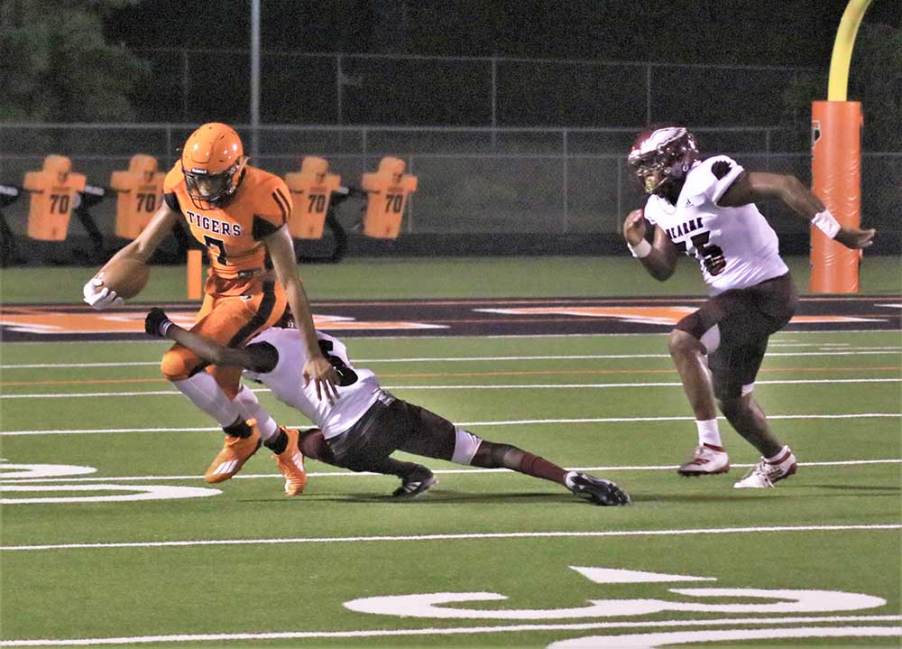 Trinity Tiger receiver Terius Maxie looks for running room following a kickoff during a game on Friday against Hearne. The Tigers lost the season opener 36-6. (Photo by Tony Farkas/TCNS )