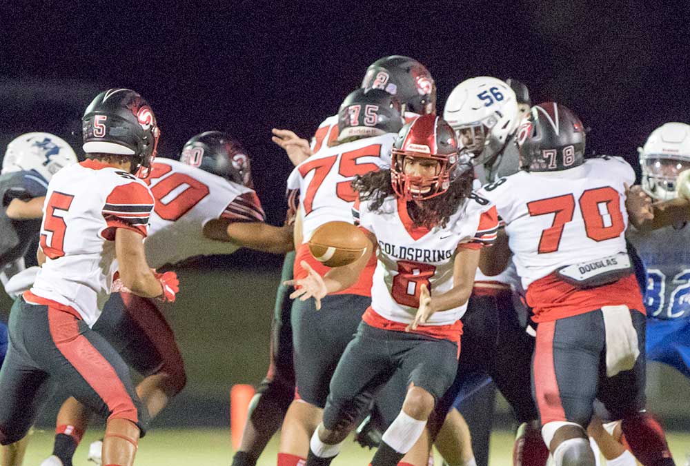 Coldspring quarterback Luke Monroe (No. 8) looks for the pitchback during the 18-14 Coldspring loss to Shepherd in the battle of San Jacinto County. (Charles Ballard Photos)