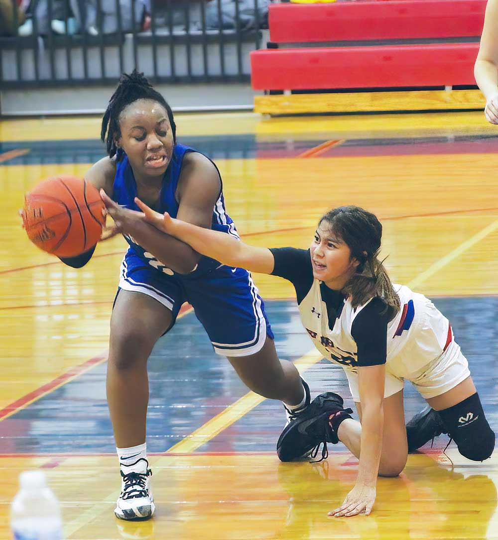 Crockett's Chelsea Walker wins the battle for a loose ball in Friday night's district game against Elkhart.  The Lady Bulldogs won 59-27. (LARRY LAMB |HCC)