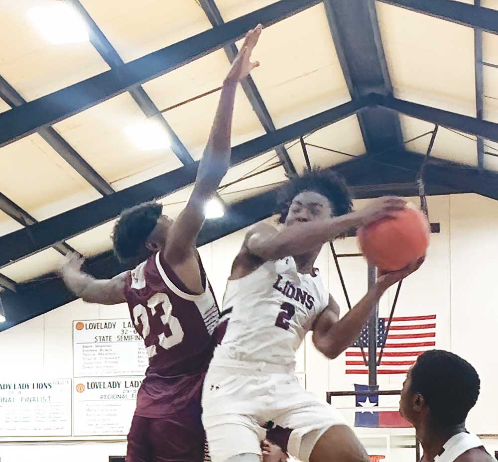Lovelady's Keivon Skinner (2) is defended by Grapeland's Omarian Wiley (23) during a district matchup last Tuesday night in Lovelady. LAWANNA MONK PHOTO