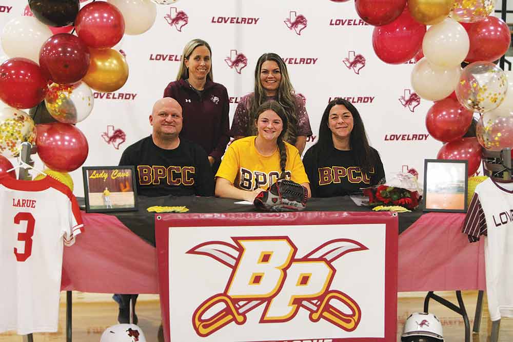 Lovelady High School celebrated a happy occasion Wednesday, Dec. 8 when senior softball player Macie LaRue signed a letter of intent with Bossier Parish Community College in Louisiana. Macie is pictured with her parents, Jeremy and Ashley LaRue, Lady Lions head coach Jordyn Hester (back right) and assistant coach Kollyn McWhinney. (Larry Lamb/HCC Photo)