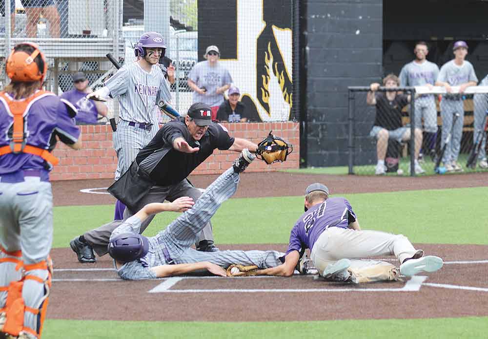 The home plate umpire calls Nick Dowdy safe as he comes home on a passed ball in the sixth inning Saturday.  LARRY LAMB | HCC