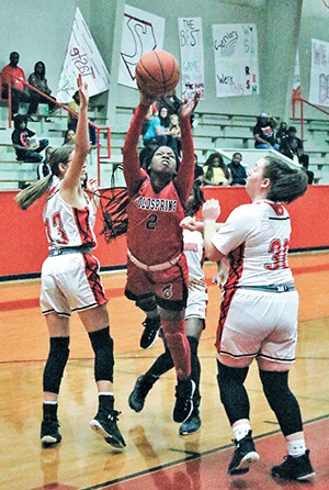 Coaldspring-Oakhurst’s Brianna Shaw-Rucker (No. 2) struggles against the defense during the Lady Trojans’ 39-29 loss to Groveton on Dec. 30. Photo by Tony Farkas