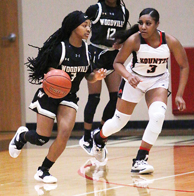 Jordyn Williams gets down the court for the Lady Eagles against the Kountze Lady Tigers last week. The Lady Eagles continued their perfect record in district (9-0) and an overall 25-4 record for the season with their 45-27 come-from-behind win against Kountze. PHOTO BY DANNIE OLIVEAUX 