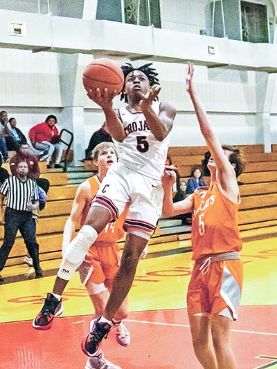 KD Bookman lays-up a 2-point basket against the Orangefield Bobcats. Photo by Charles Ballard