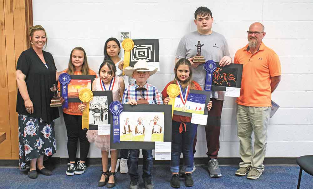 Winners of the Houston Livestock Show and Rodeo Art Contest were honored at the Trinity School Board Meeting on April 19. They include (from left) Savannah Breaux, Best of Show, Middle School; Denise Puente-Manzanares, gold medal; Evelyn Rangel, gold medal; Drason Owens, Best of Show, Elementary; Kamri Scott, gold medal; and Justin Downing, Best of Show, High School. The group was sponsored by Jolynn Harper, and taught by Joshua Smith and Damar Green. Photos by Tony Farkas